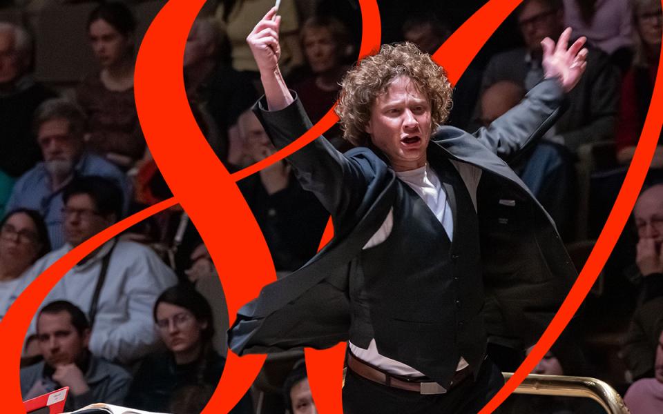 Santtu-Matias conducting with his arms in the air. There is a red 80 design laid on top of the image