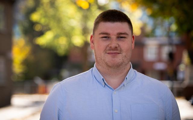 Matthew smiling at camera outside Philharmonia office