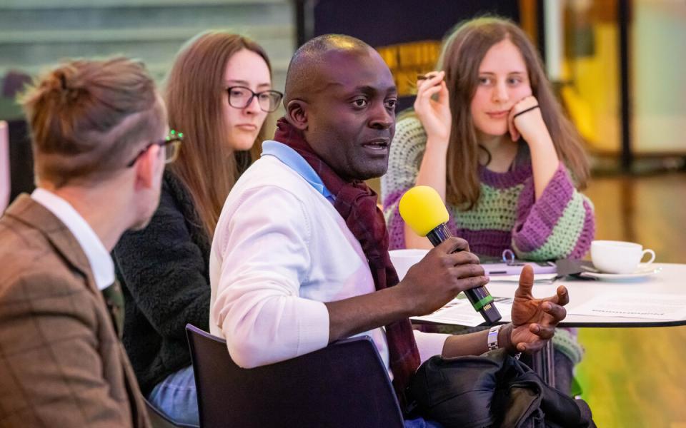 Man talking into a microphone