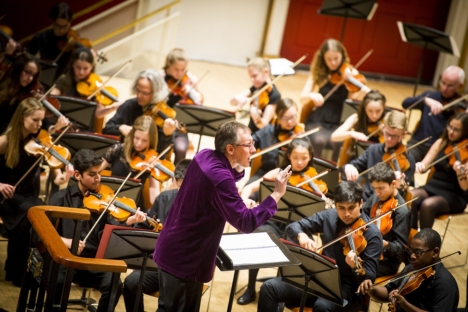 Young orchestra performing on stage